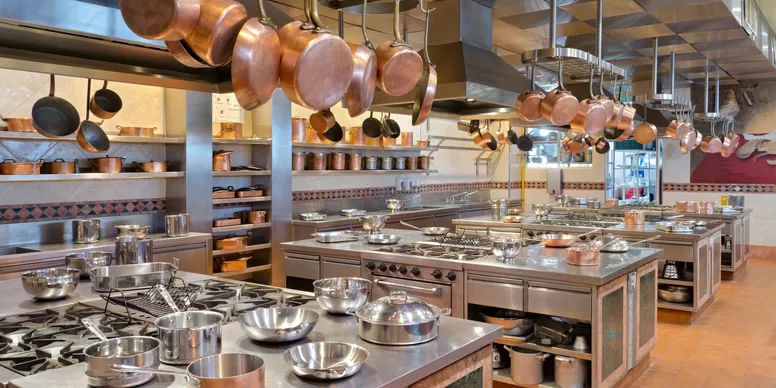 Professional kitchen with hanging pots and pans